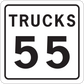 Road sign sticker with “TRUCKS” and “55” on a white square sign