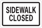 Road sign sticker with rectangular “SIDEWALK CLOSED” text on white background