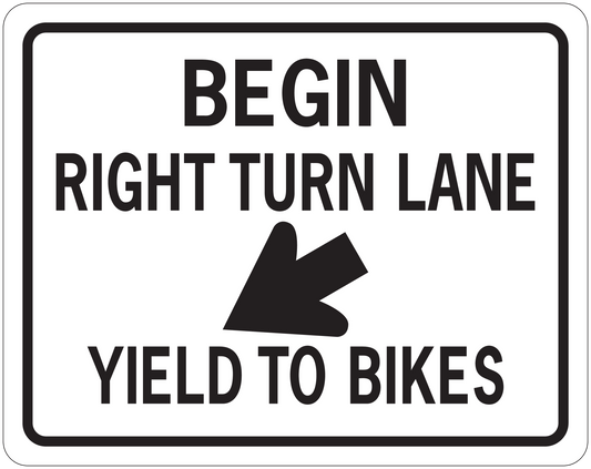 Road sign sticker with white rectangle and black text: BEGIN, RIGHT TURN LANE, YIELD TO BIKES