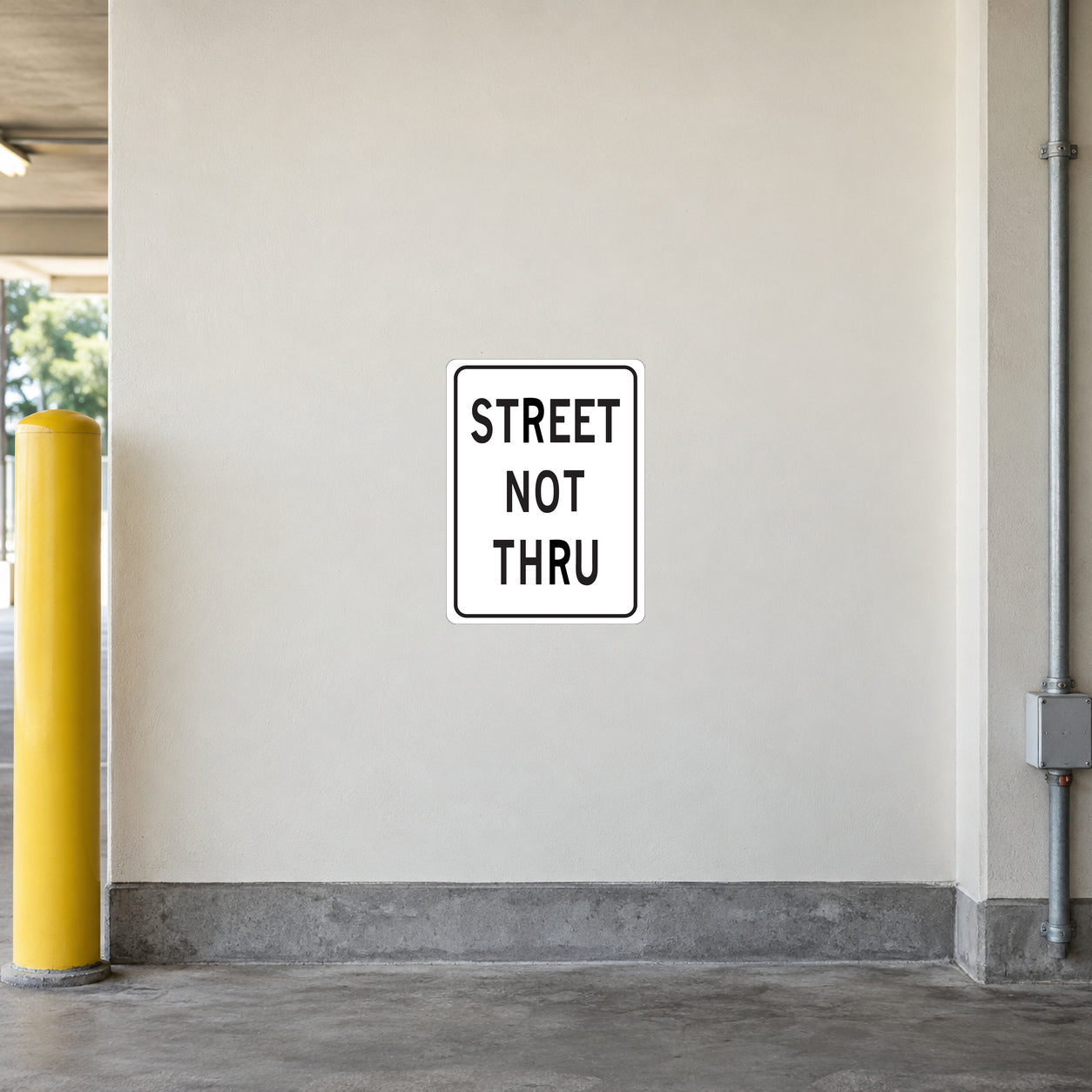 Road sign sticker with 'STREET NOT THRU' text in a white square