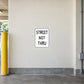 Road sign sticker with 'STREET NOT THRU' text in a white square