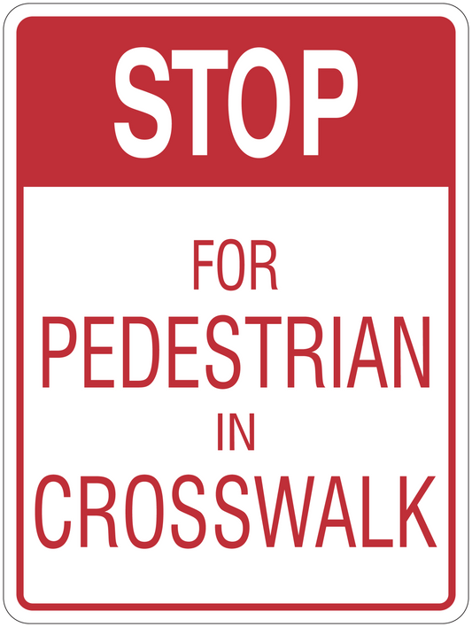 Road sign sticker with red STOP and text FOR PEDESTRIAN IN CROSSWALK