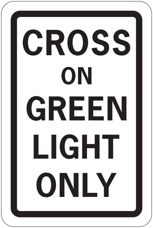 Road sign sticker with 'CROSS ON GREEN LIGHT ONLY' text, green background, white border.