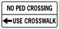 Road sign sticker with white background, black text: “No Ped Crossing” and “Use Crosswalk” arrows