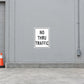 Road sign sticker reading 'NO THRU TRAFFIC' with black text and white border