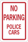 Road sign sticker reading "NO PARKING POLICE CARS" with red border on white