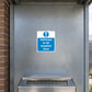Blue and white safety sign sticker reading "Ashtrays to be emptied here"
