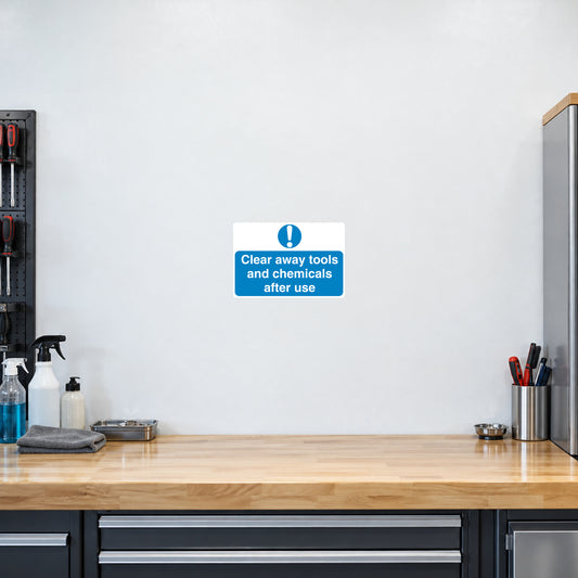Safety sign sticker: blue text 'Clear away tools and chemicals after use'