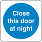 Safety sign sticker: blue circle with 'Close this door at night' text.
