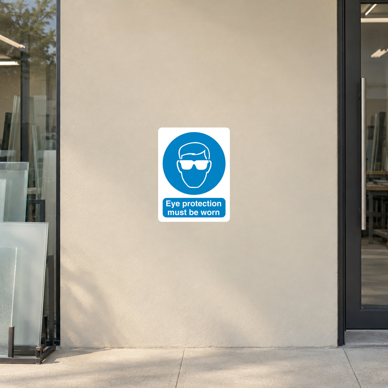 Safety sign sticker with blue eye protection icon and text "Eye protection must be worn"
