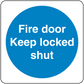 Safety sign sticker with blue circle and white text: “Fire door Keep locked shut”