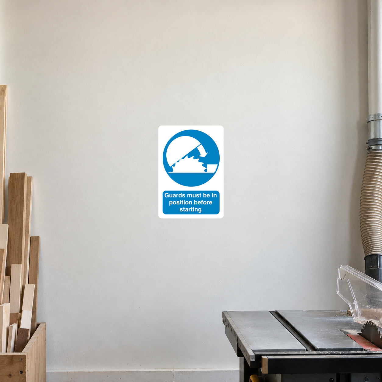 White square safety sign sticker with blue guard-in-position icon and text