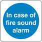 Safety sign sticker with blue circle and white text: In case of fire sound alarm