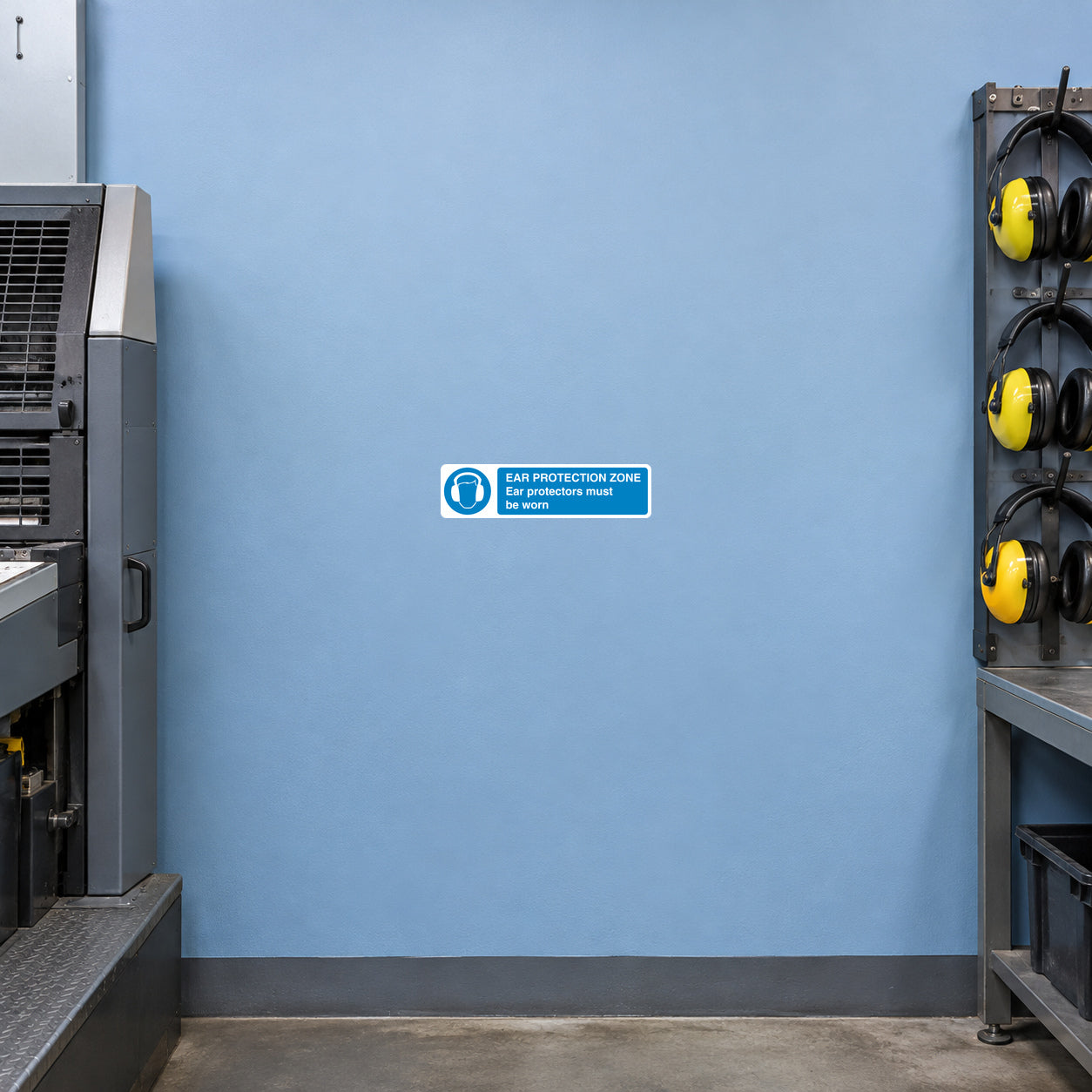 Safety sign sticker with ear protection icon and small blue text