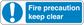Safety sign sticker with blue panel, white exclamation icon and text: Fire precaution keep clear