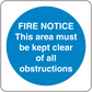 Safety sign sticker: blue circle with 'FIRE NOTICE' and 'kept clear of all obstructions'