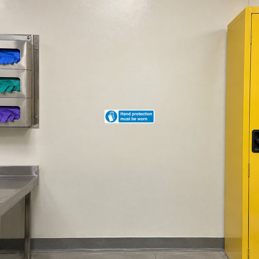 Safety sign sticker: “Hand protection must be worn” blue label with white text