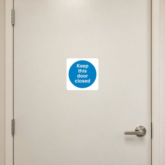 Safety sign sticker: white square with blue circle reading 'Keep this door closed'