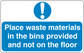 Safety sign sticker with exclamation icon and text: Place waste materials in bins, not floor