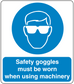Safety sign sticker with blue goggles icon and text: must be worn when using machinery