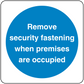 Safety sign sticker with circle: white text 'Remove security fastening when premises are occupied'