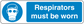 Safety sign sticker with respirator icon and text 'Respirators must be worn'
