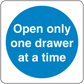 Safety sign sticker with blue circle and white text: Open only one drawer at a time