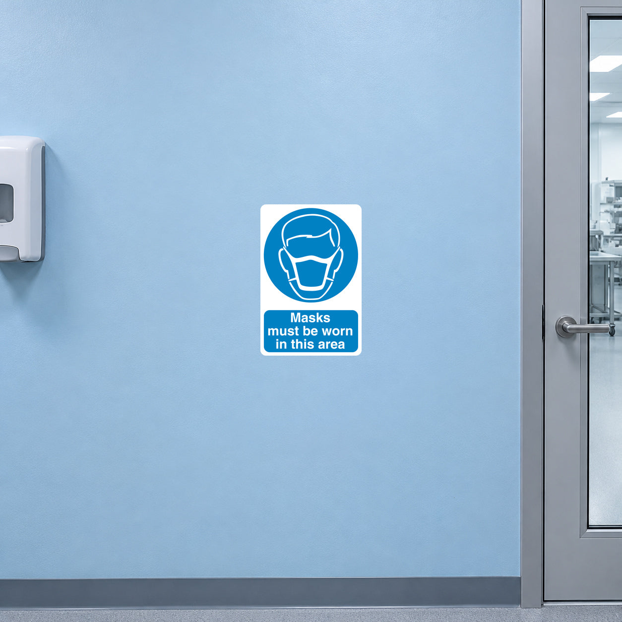 Safety sign sticker with blue mask icon: 'Masks must be worn in this area'.