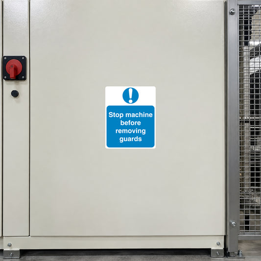 Safety Sign Sticker applied in a smooth cream machine enclosure access panel next to a steel protective guard, guard entirely extreme right and switch hardware far left, central blank