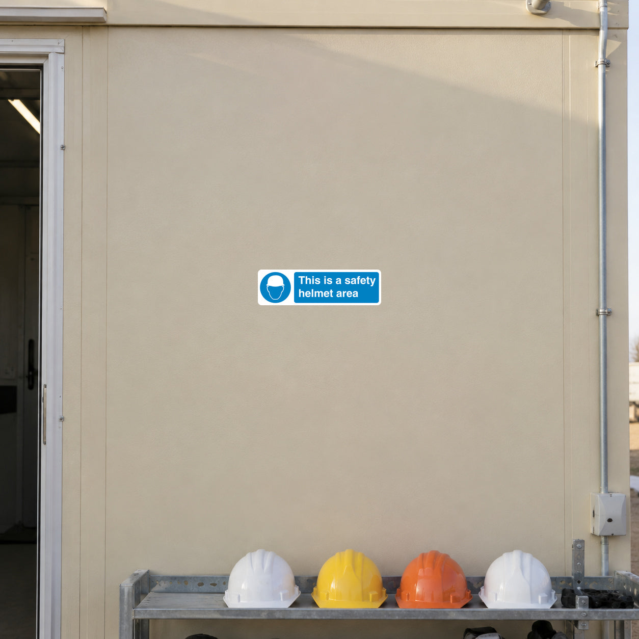 Safety helmet area sign sticker in blue with 'This is a safety helmet area'