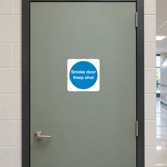 Safety sign sticker with blue circle text: “Smoke door, Keep shut”