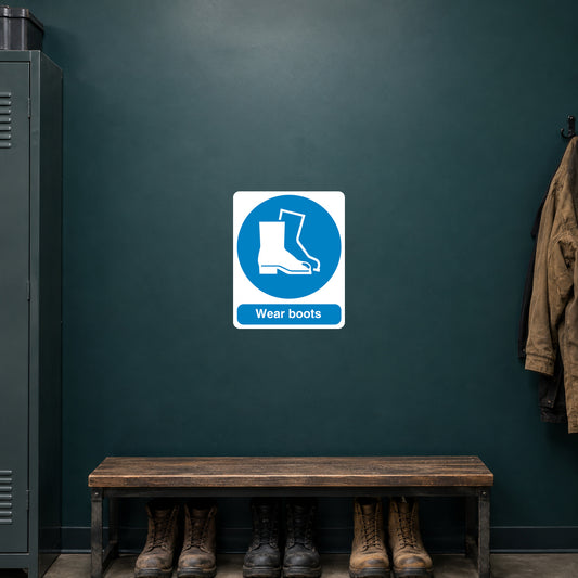 Safety sign sticker with blue circle boot icon and “Wear boots” text on white square