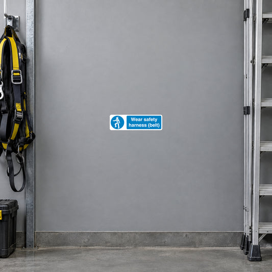 Blue safety sign sticker with white text: “Wear safety harness (belt!)” and icon
