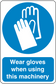 Safety sign sticker with blue hands icon and text: Wear gloves when using this machinery