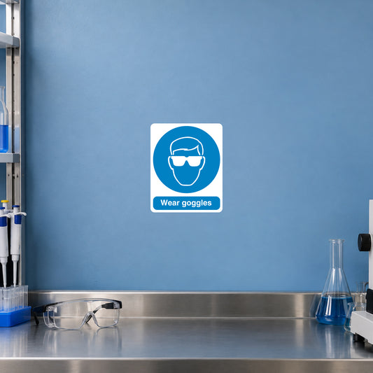 Safety sign sticker: square white and blue icon with “Wear goggles” text