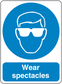 Safety sign sticker with blue circle and white goggles icon, text 'Wear spectacles'