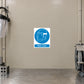 Safety Sign Sticker applied in Smooth beige metalworking partition, transparent protective visor hanging far left and bench grinder edge far right