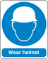Safety sign sticker with blue circle and white helmet icon, text 'Wear helmet'.