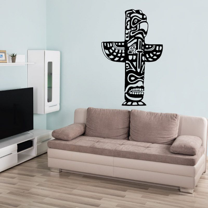 Black totem pole wall decal with patterned tribal figure, outlined in white.