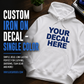 White hoodie with single-color blue iron-on decal across the chest