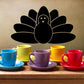 Black turkey decal with fan tail and simple line-drawn feathers, centered above cups