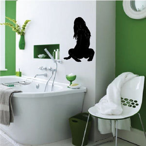 Black sitting woman looking back silhouette decal