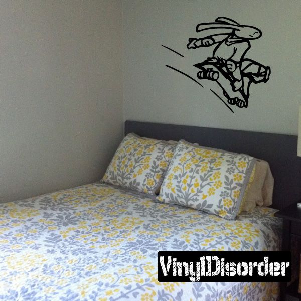 Skateboarding bunny wall decal, black vinyl outline