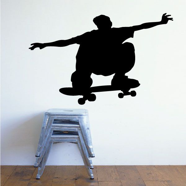Skateboarding wall decal: black skateboarder silhouette in mid-trick
