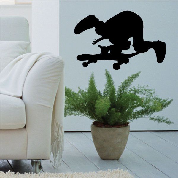 Skateboarder wall decal vinyl sticker, black silhouette on skateboarding board