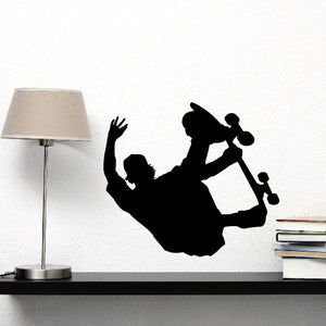 Black skateboarder wall decal silhouette on a skateboard