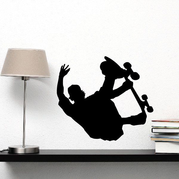 Black skateboarder wall decal silhouette on a skateboard