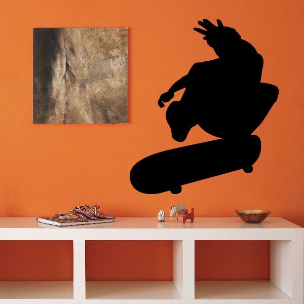 Skateboard wall decal featuring a black skateboarder silhouette in mid-trick