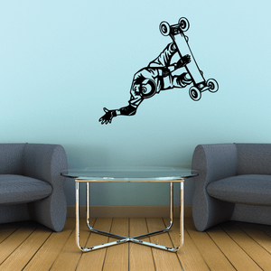 Skateboarding wall decal of a cartoon skater doing a spin on a board, black and white