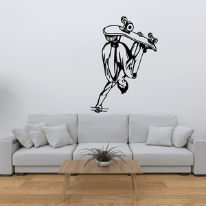Skateboarding wall decal of a black cartoon skater with skateboard and hat
